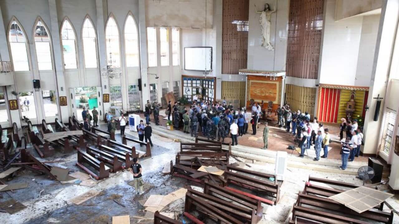 A handout photo made available by the PPD shows a damaged church inspected by Philippine President Rodrigo Duterte in Jolo, Sulu province, 28 Jan 2019.