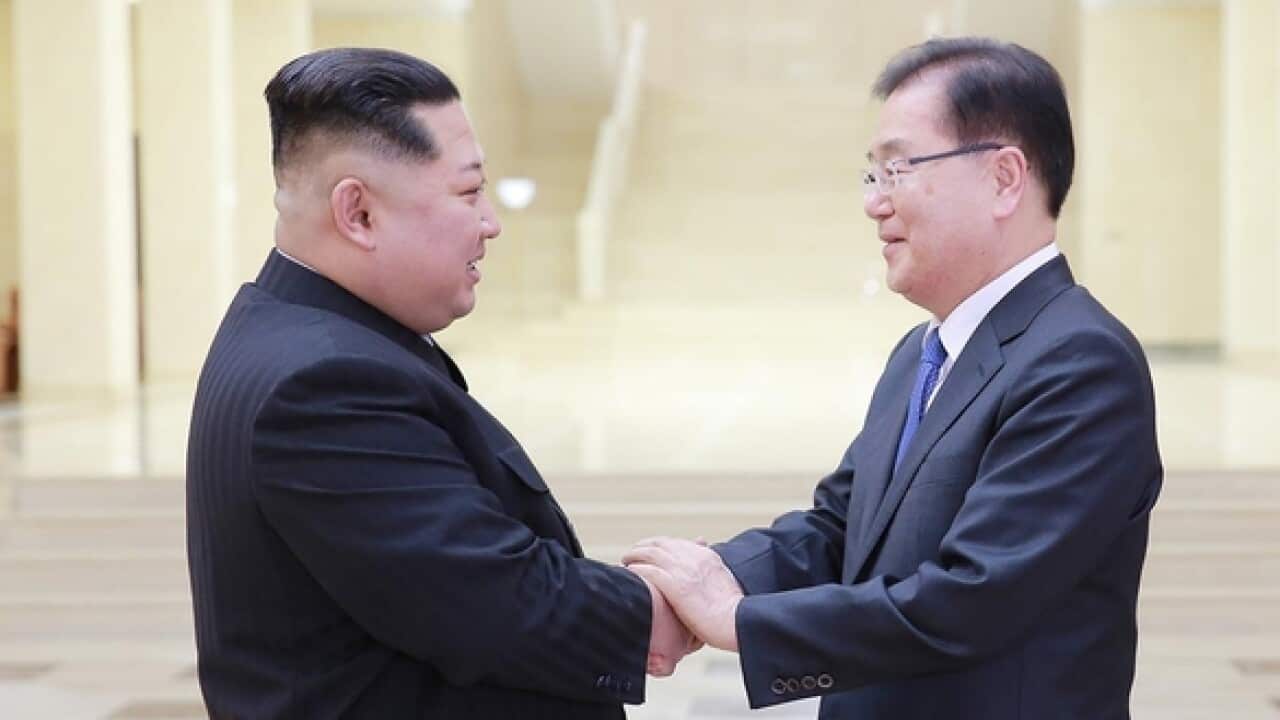 North Korean leader Kim Jong-un meets with the Korean envoy delegate.