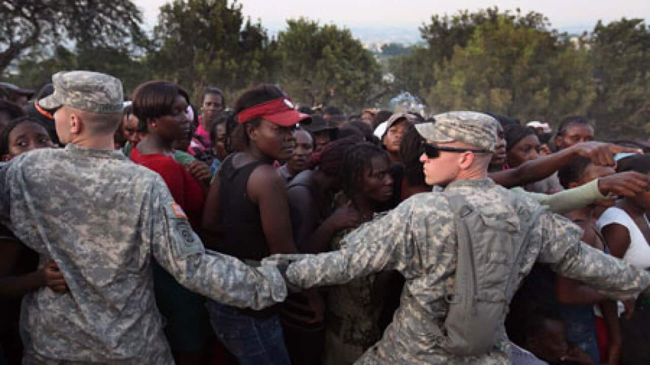 troops_hold_haitians_back_100120_getty_1032598320