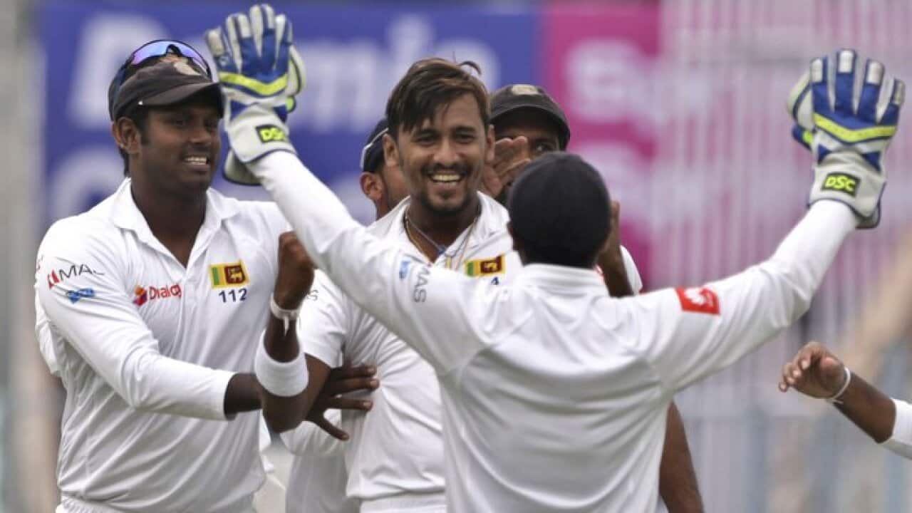 Sri Lanka's Suranga Lakmal, center without cap, celebrates with teammates the dismissal of India's Lokesh Rahul during the first day of their first test cricket match in Kolkata, India, Thursday, Nov. 16, 2017. (AP Photo/Bikas Das)