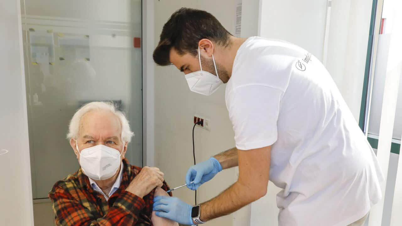 A man receives a Pfizer vaccine in Vienna
