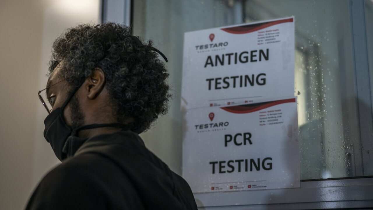 A person queues to be tested for COVID-19 in Johannesburg, South Africa