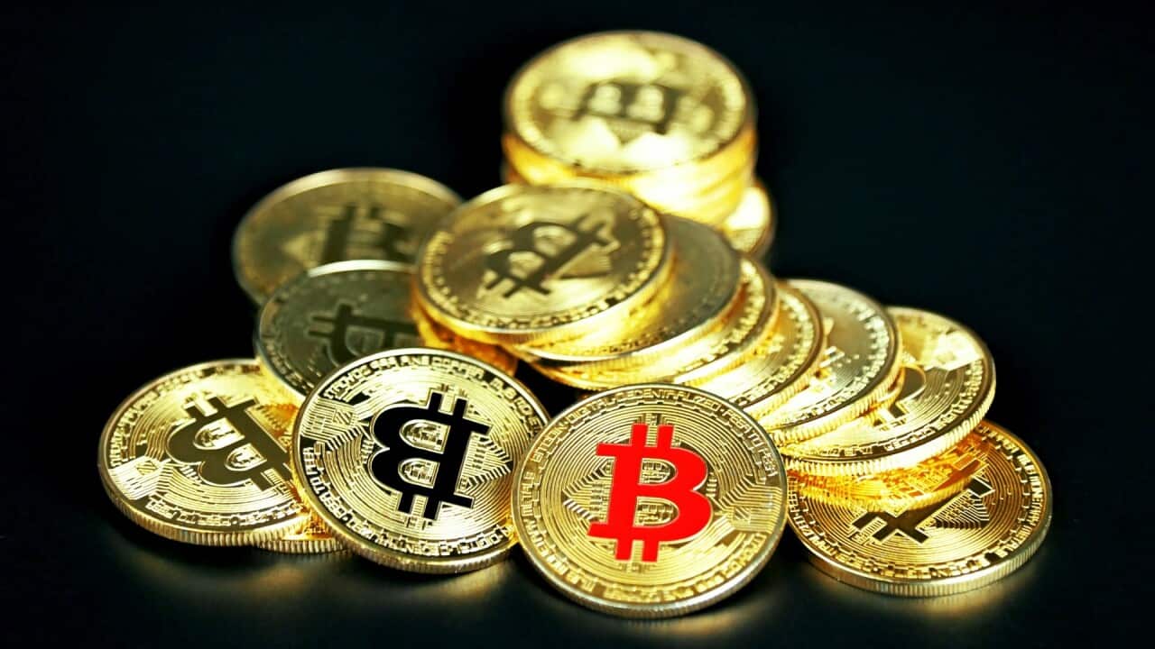 Golden Bitcoin on black background -Executium-Unsplash