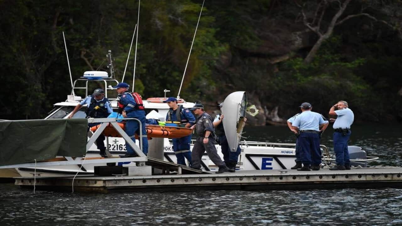 Body of a passenger aboard a seaplane that crashed is brought ashore.