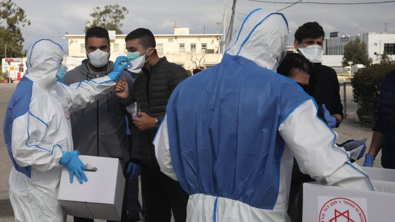 People quarantined with Corona virus arrive to vote at a specially made tent in Haifa, Israel, Monday, 2 March, 2020.