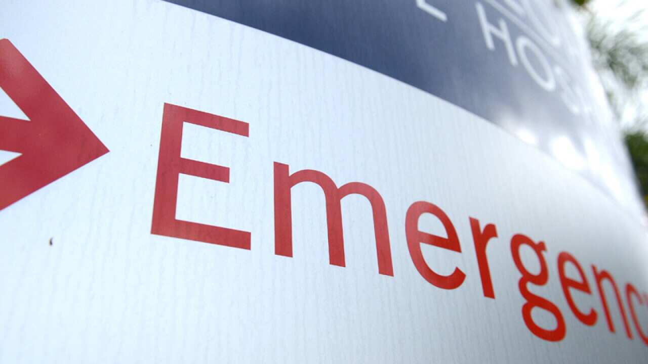 An emergency department sign at the entrance to a hospital in Brisbane