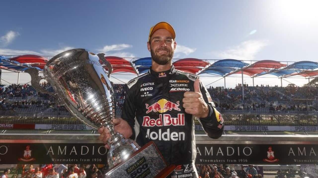 Shane van Gisbergen poses for a photograph with the winners trophy.