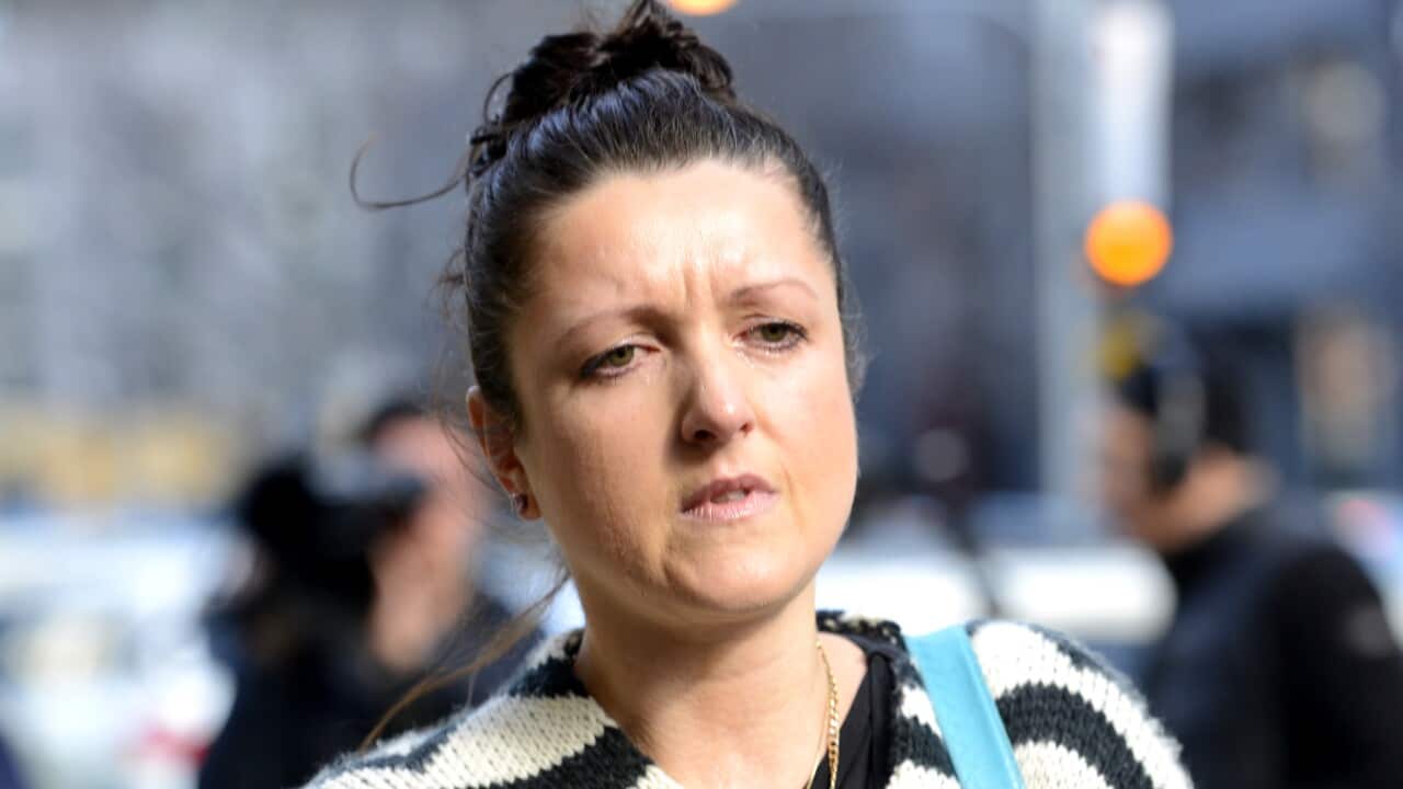 Nikki Komiazyk the daughter of Terence and Christine Hodson who were murdered in 2004 leaves the Coroners Court of Victoria in Melbourne, Friday, July 31, 2015. (AAP Image/Tracey Nearmy) NO ARCHIVING