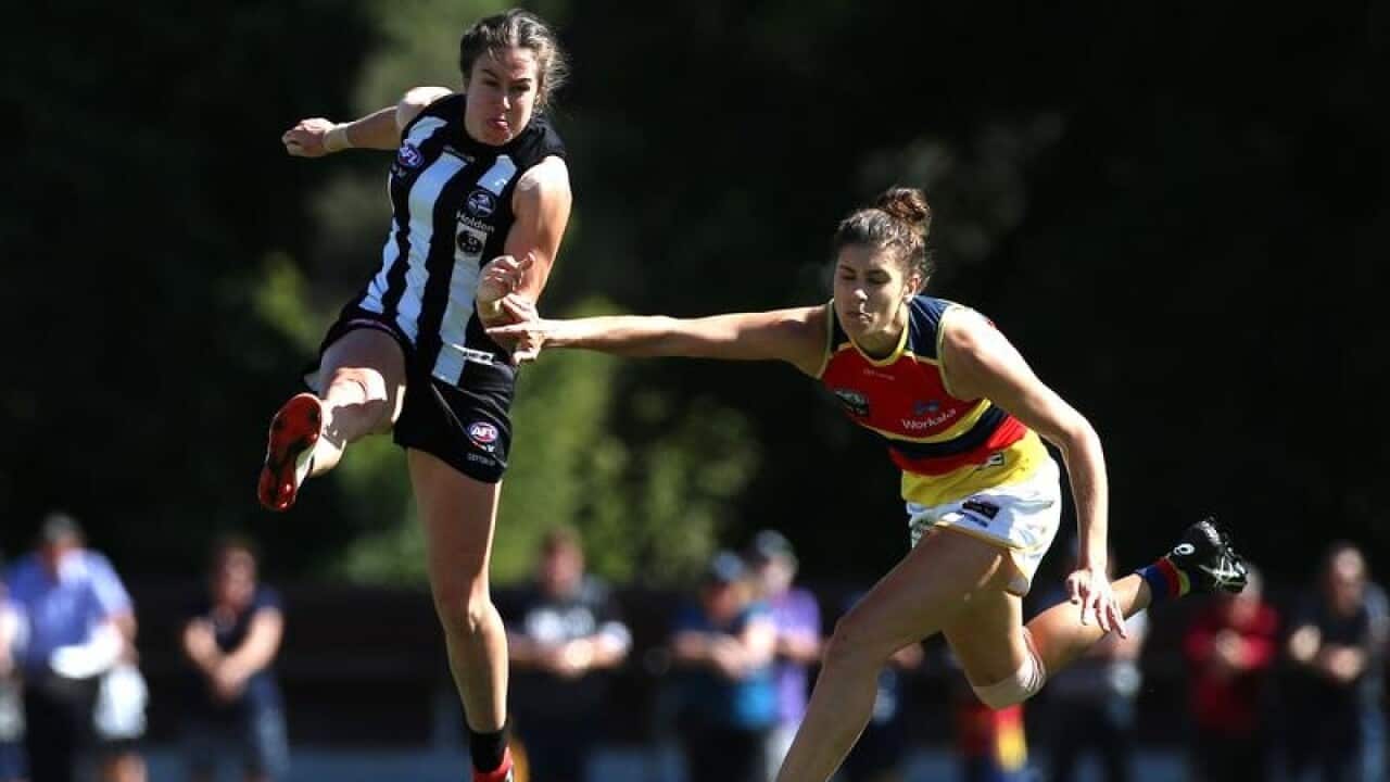 Collingwood's Caitlyn Edwards and Adelaide's Jasmyn Hewett in action.