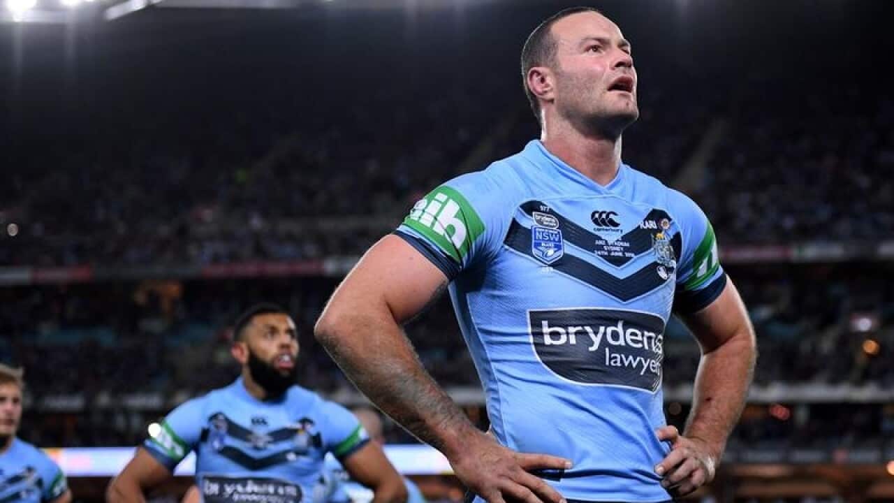 Boyd Cordner of the NSW Blues looks at a video replay.