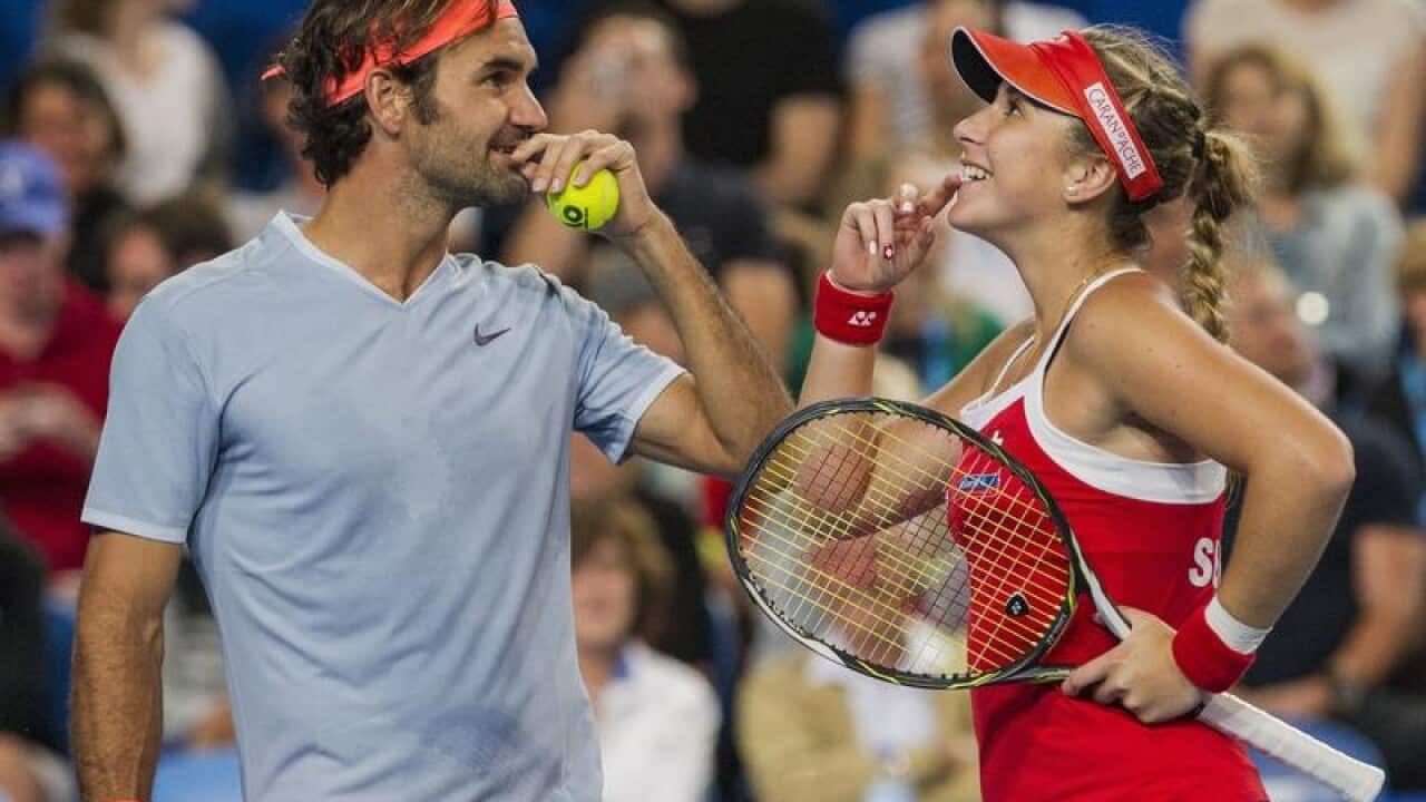 Belinda Bencic and Roger Federer during the mixed doubles match