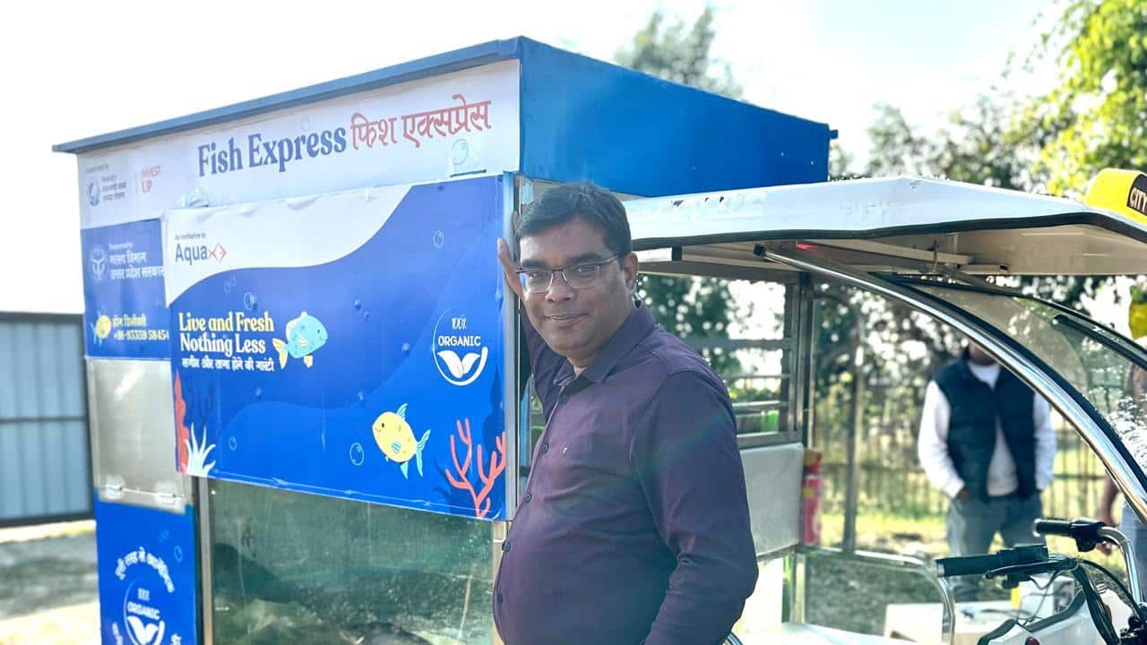 Sujit Kumar Choudhary with his designed E-Rickshaw for selling fresh fish..jpeg