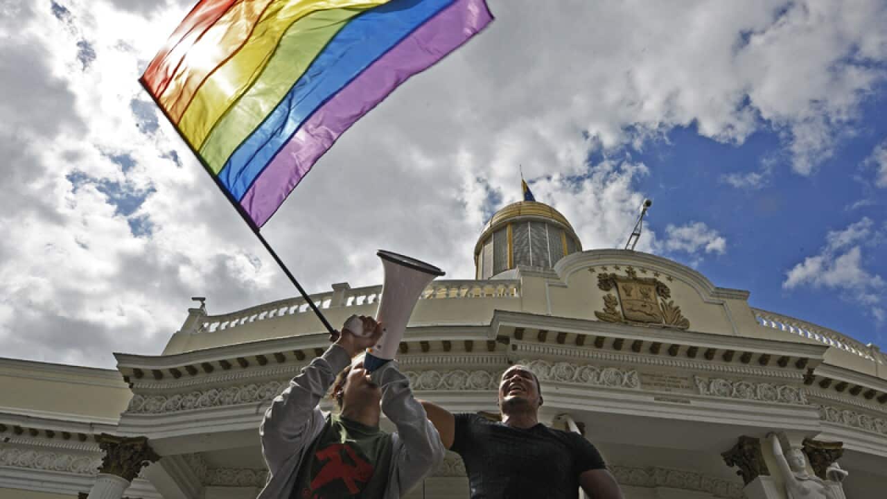 Gay rights activists demonstrate outside Venezuela's parliament