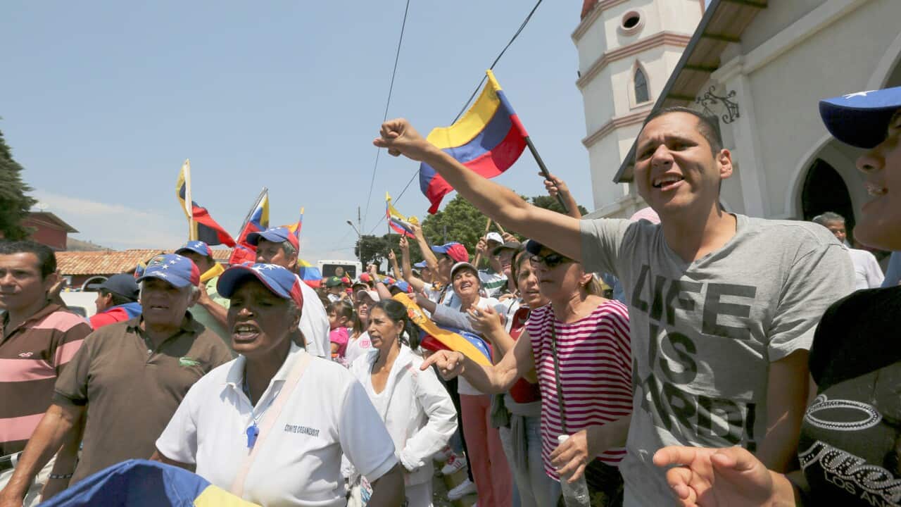 Opposition members shout slogans against Venezuela's President Nicolas Maduro during a rally to support the arrival of humanitarian aid in Capacho, Venezuela.