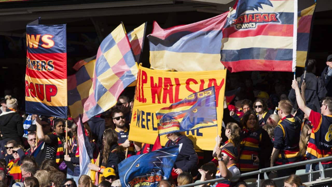 Fans and supporters attend the Phil Walsh memorial.