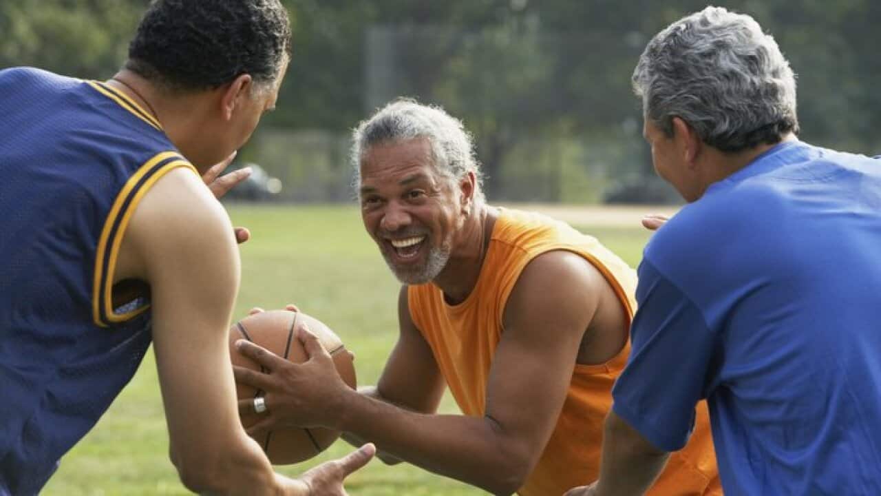 Men playing basketball