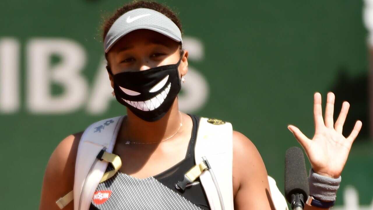 epa09239786 (FILE) - Naomi Osaka of Japan celebrates winning against Patricia Maria Tig of Romania during their first round match at the French Open tennis tournament at Roland Garros in Paris, France, 30 May 2021 (re-issued 31 May 2021). Osaka announced