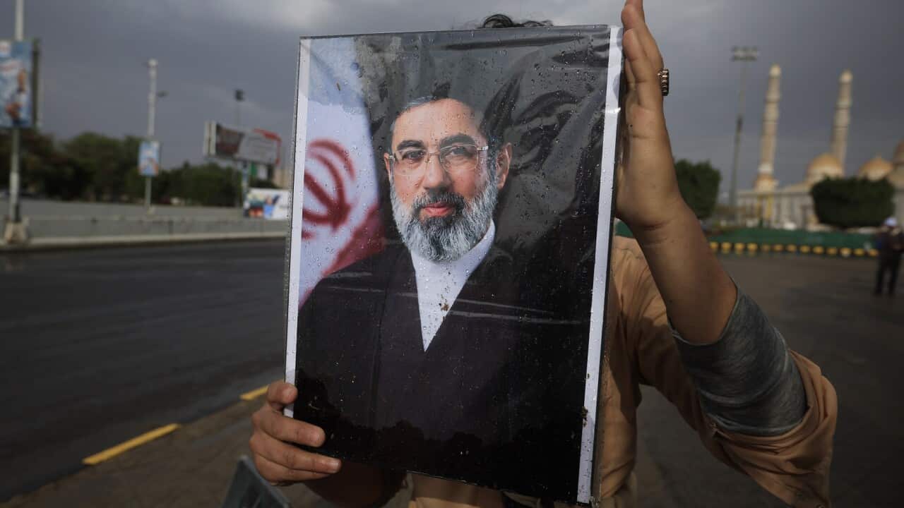 Portraits of Iranian leaders in Sana'a amid US-Israel-Iran conflict.