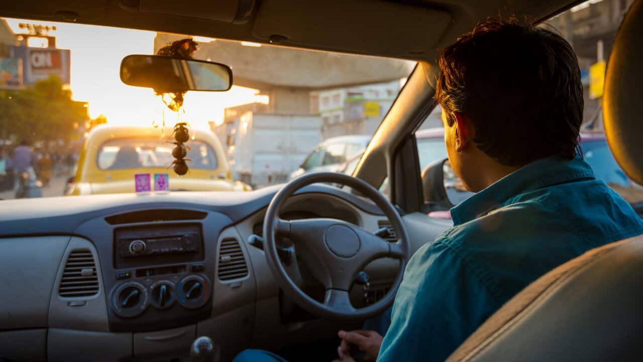 Indian driver is driving on the road during rush hour in Kolkata