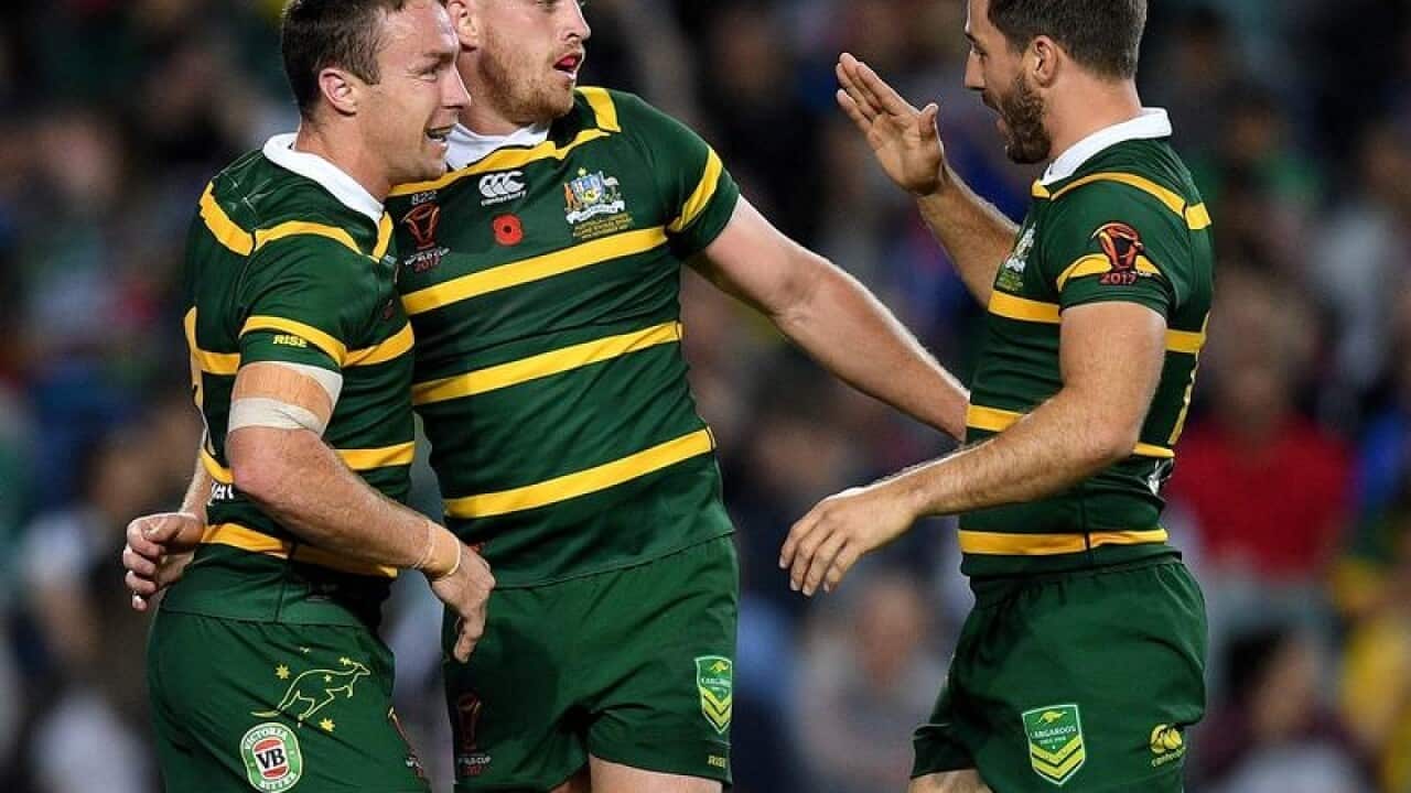 Australia rugby league players Cameron Munster (c) and Ben Hunt (r)