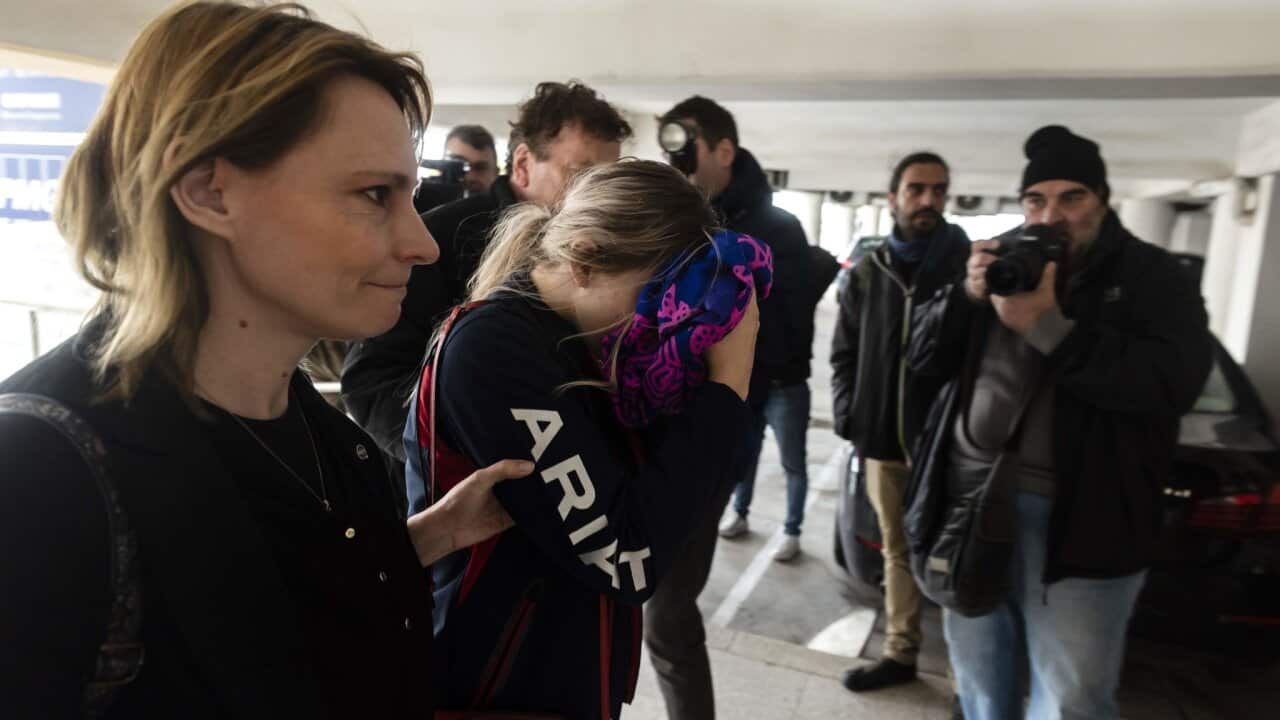 The British woman who was charged with public mischief, center, arriving at court in Paralimni, Cyprus, on Monday.Credit...