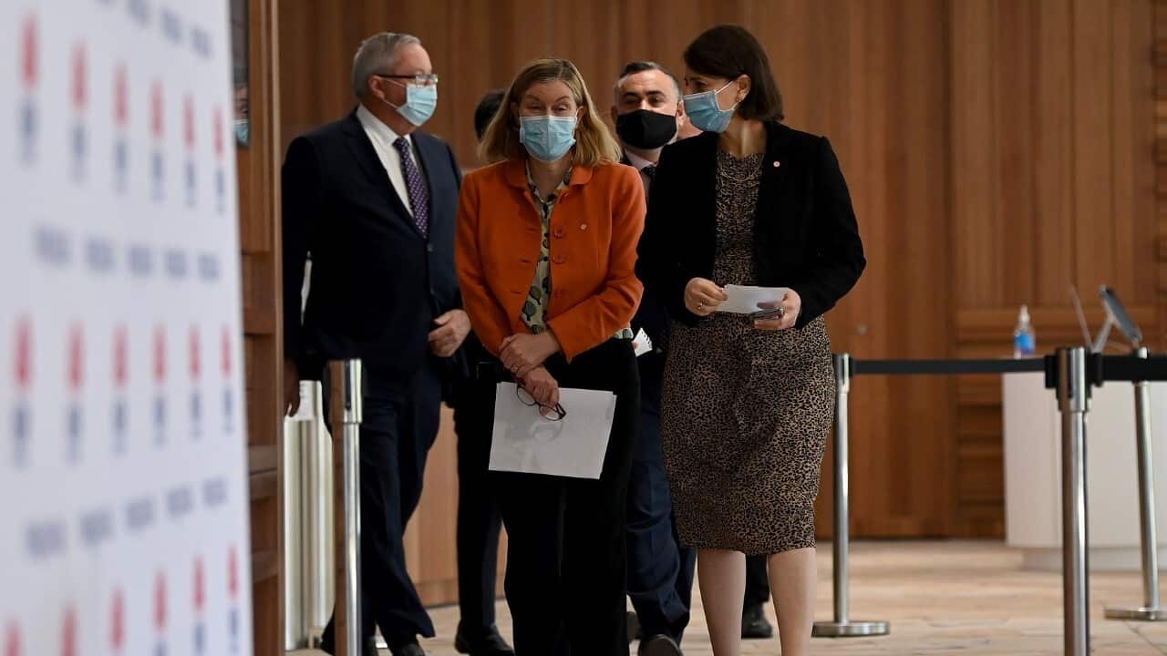 NSW Chief Health Officer Dr Kerry Chant and NSW Premier Gladys Berejiklian arrive for a COVID-19 press conference (AAP)