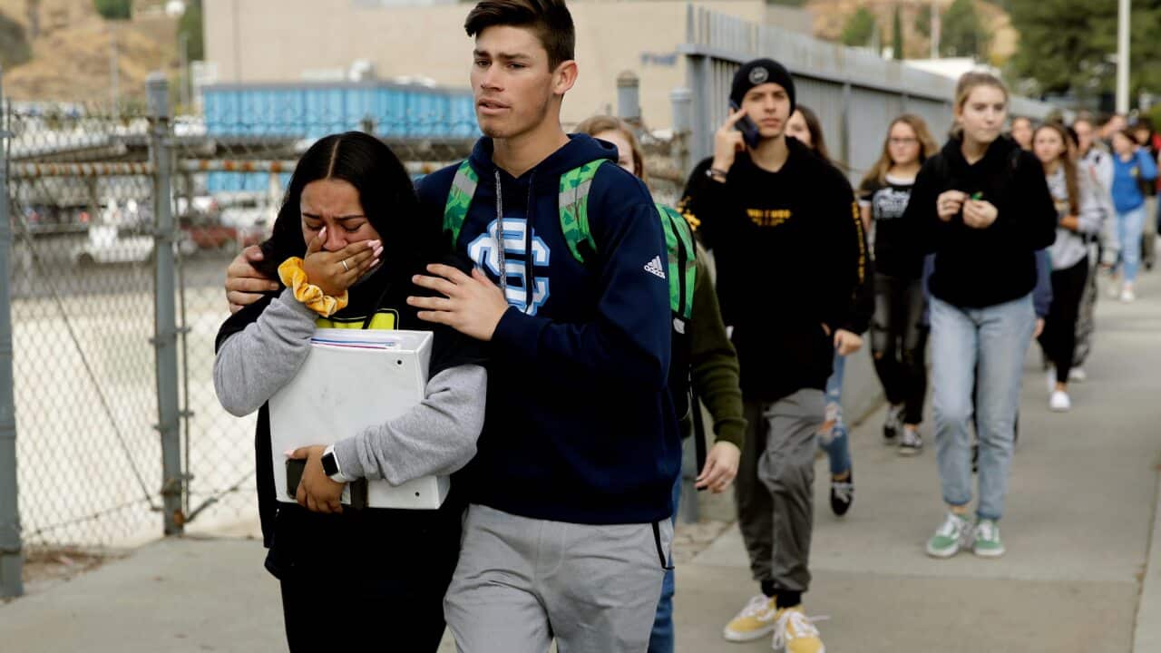 Students are escorted out of Saugus High School after reports of a shooting on Thursday, Nov. 14, 2019, in Santa Clarita, Calif. (AP Photo/Marcio Jose Sanchez)