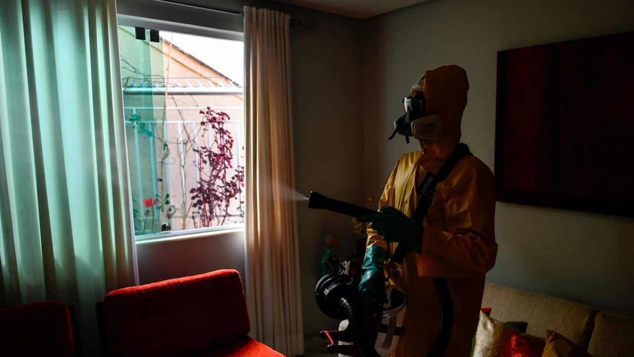 An employee of a private company sanitises against the spread of coronavirus in Brazil.