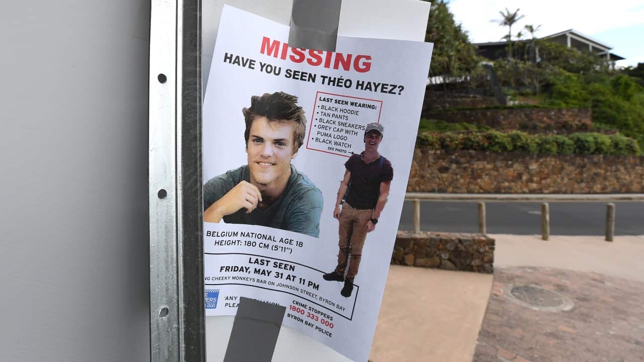 A missing persons flyer is seen near a beach as the search continues for missing backpacker Theo Hayez at Byron Bay.