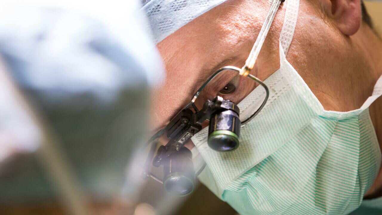 A doctor performing surgery