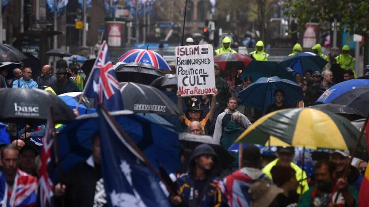 Protesters holding anti-Muslim placards at a Reclaim Australia Rally at Martin Place in Sydney on Saturday, April 4, 2015.