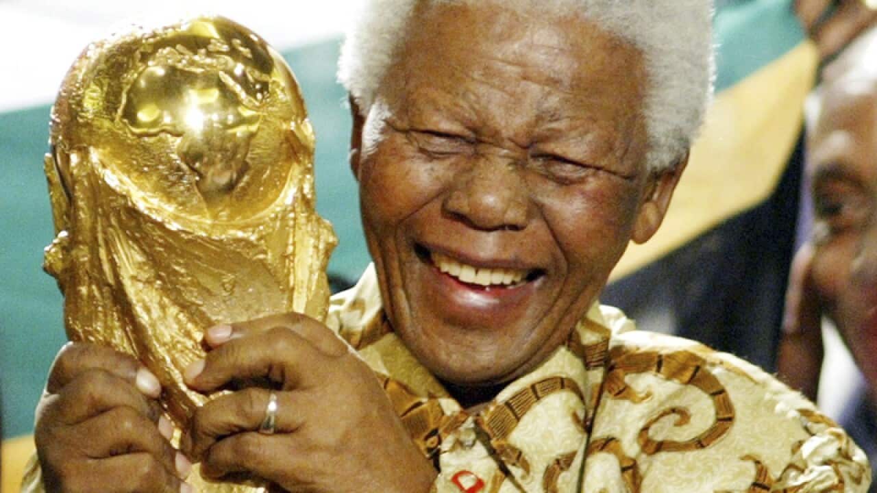 Nelson Mandela lifts the World Cup trophy in Zurich