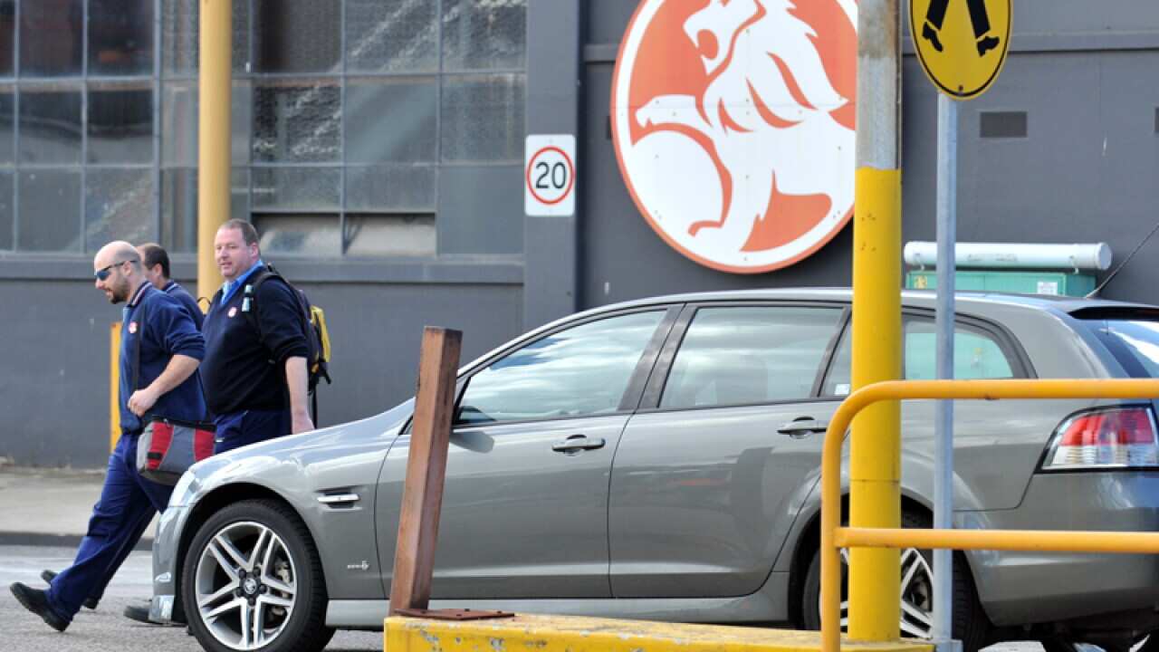 Workers leaves the Port Melbourne plant in Melbourne
