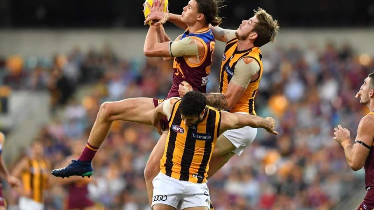 Eric Hipwood of the Lions takes a mark during the Round 9.