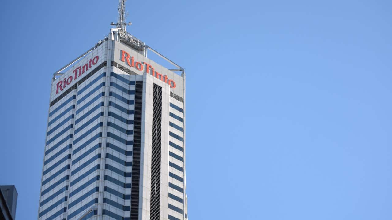 Rio Tinto logo at the top of a high-rise building. Shares in Rio Tinto fell after Serbia revoked its lithium exploration licenses over environmental concerns.
