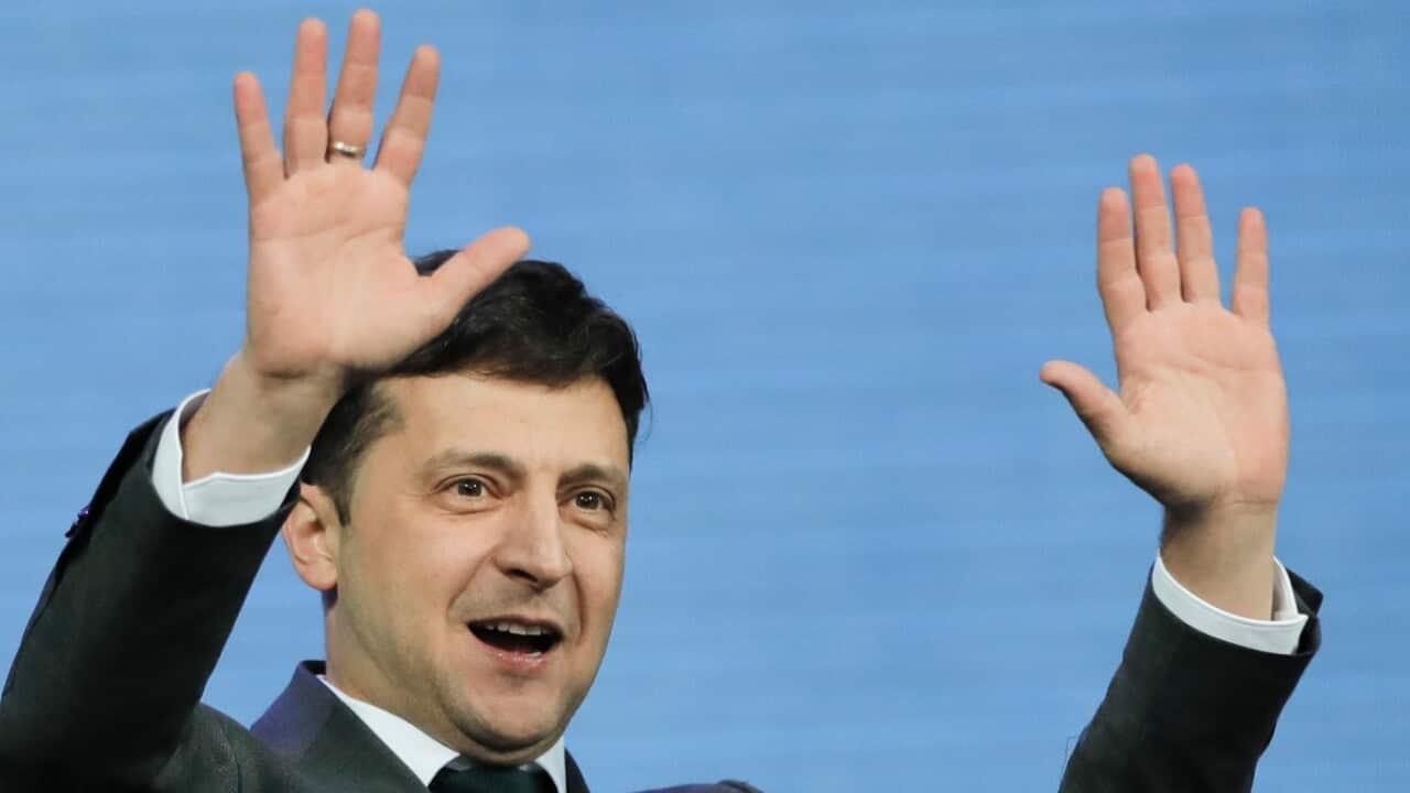 Ukrainian presidential candidate and popular comedian Volodymyr Zelenskiy waves before the final debate of the electoral campaign 