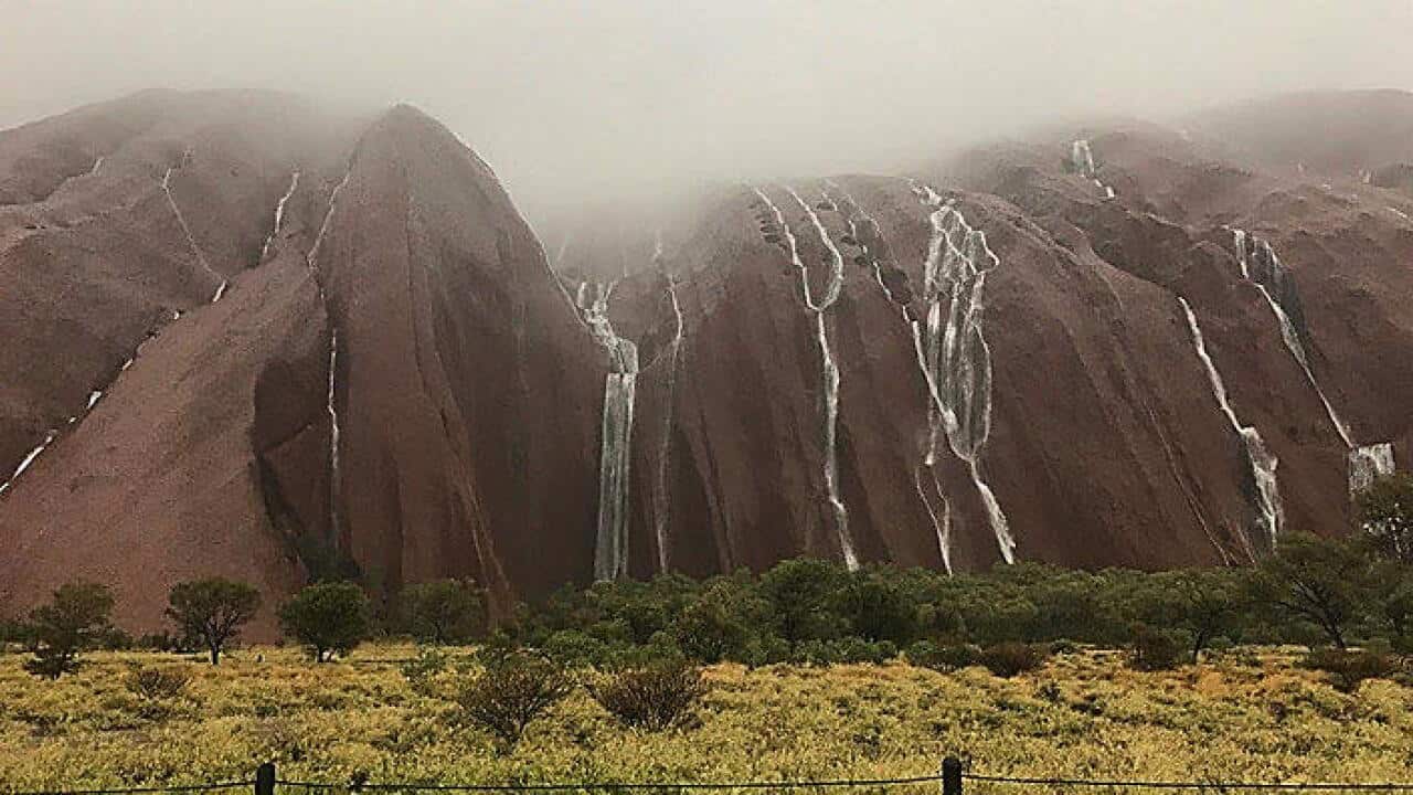 In an image acquired from social media shows Uluru, or Ayers Rock, under rainfall, Monday, Dec. 26, 2016.