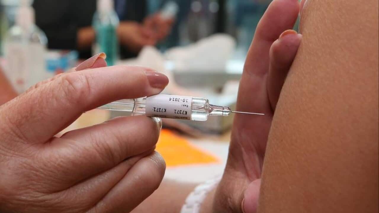 A close up of a vaccination