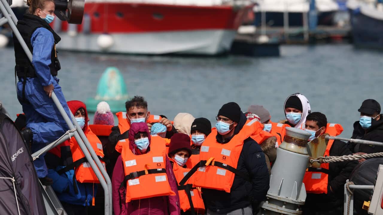 Asylum seekers arrive in the UK after being picked up in the channel by the Border Force in Dover, England.