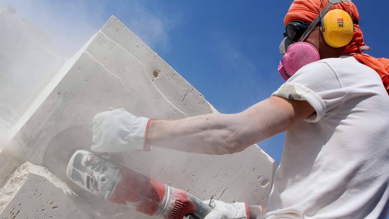 A worker is cutting stone -Alireza Naseri-Unsplash.jpg