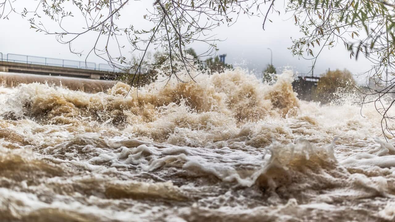 Flooded river during persistent heavy rain.