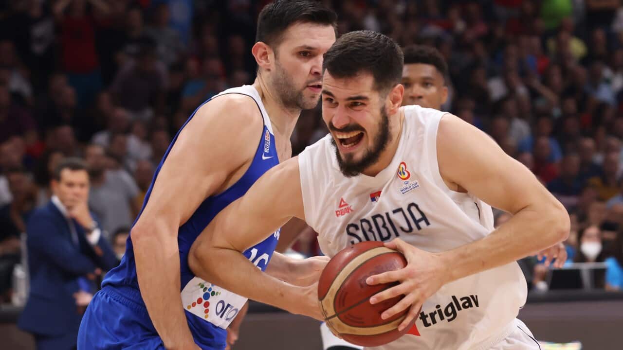 Serbia's Nikola Kalinic (R) in action against Greece's Kostas Papanikolaou (L) during the FIBA Basketball World Cup 2023 qualifiers match between Serbia and Greece in Belgrade