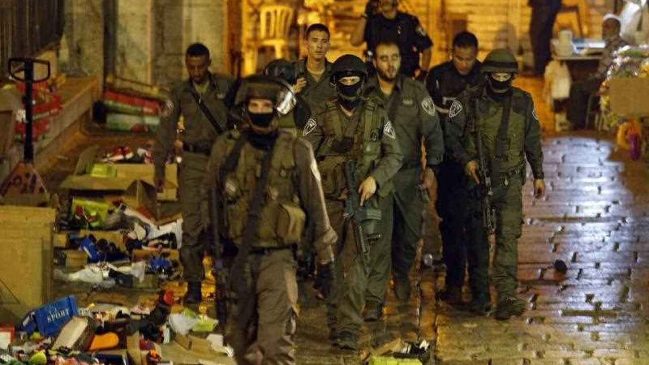 Israeli security forces at the scene where two Israelis were killed and two others were seriously injured by a Palestinian attacker in the Old City of Jerusalem