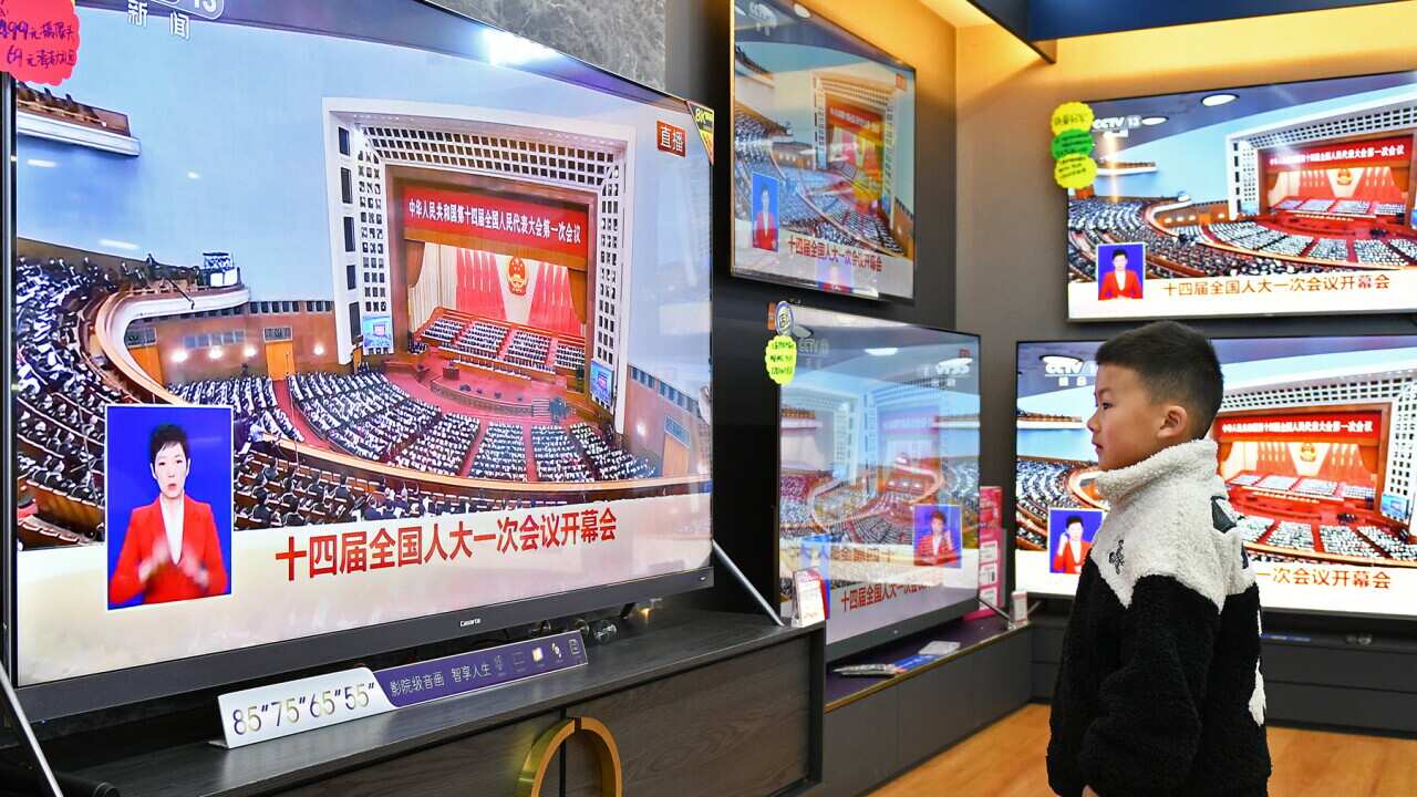 A child watches the National People's Congress in China (AAP).jpg