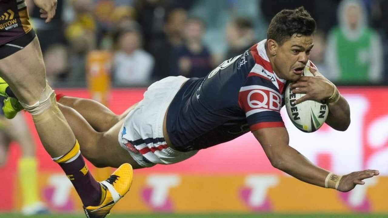 Latrell Mitchell of the Roosters scores the match winning try.