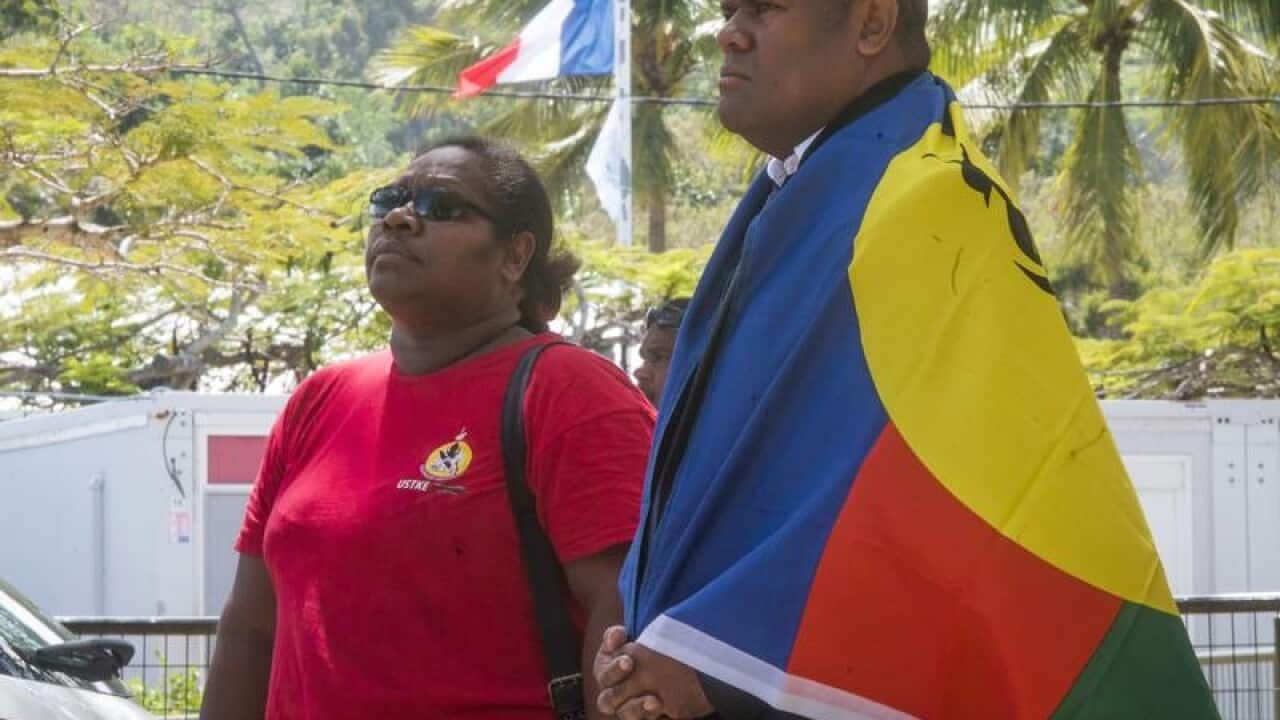 New Caledonia residents line up to vote.
