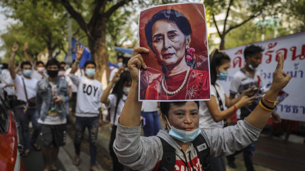 Myanmar protesters hold up a portrait of Aung San Suu Kyi during an anti-coup rally