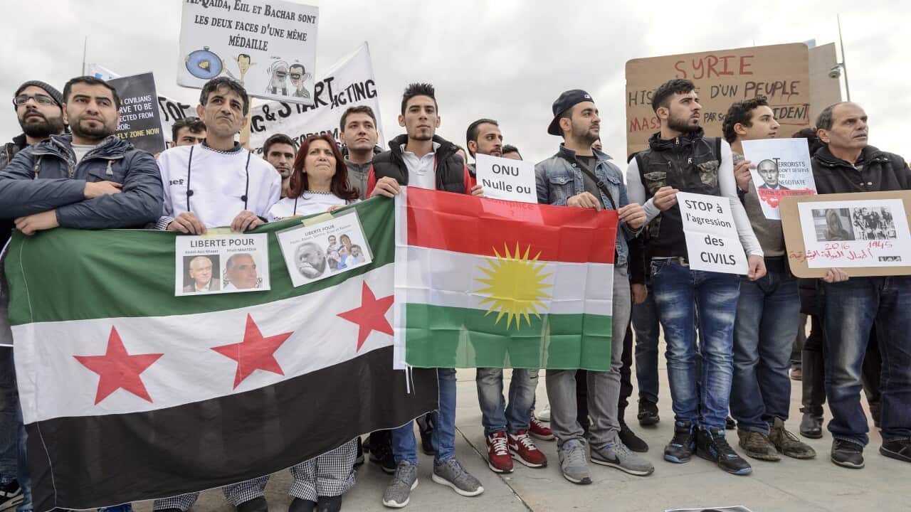Protesters during a demonstration against the Syrian government, ahead of the start of Syrian Peace talks between the Syrian government and the opposition in Geneva