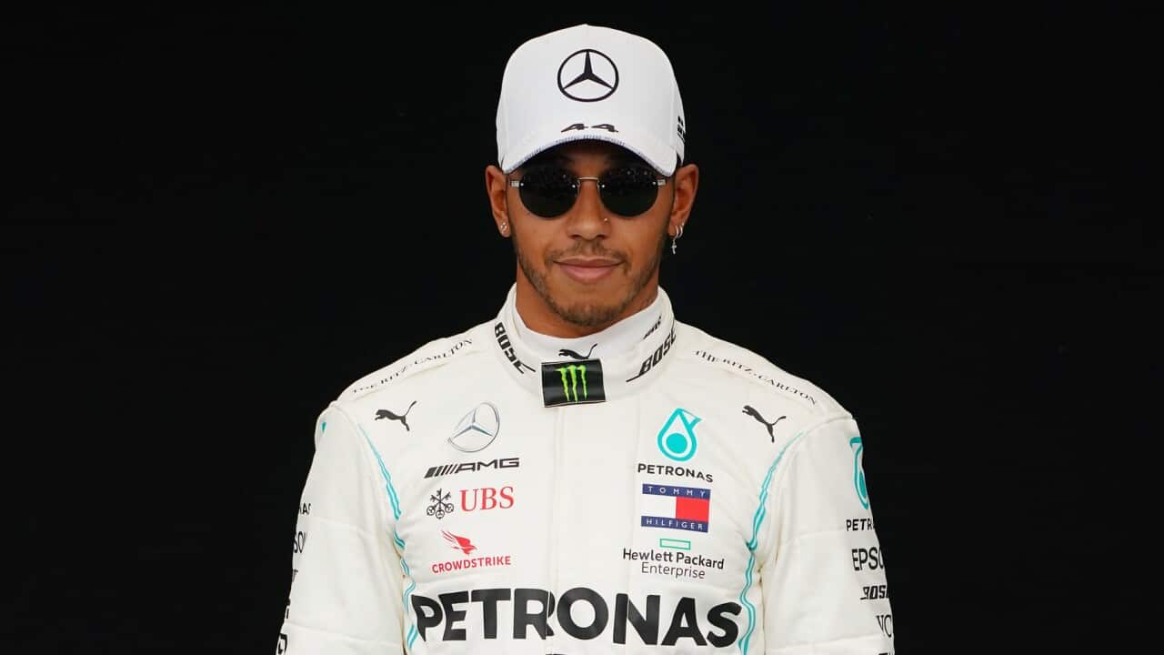 Lewis Hamilton of Great Britain and Mercedes GP poses for a photo in the Paddock ahead of the Formula 1 Australian Grand Prix 2020