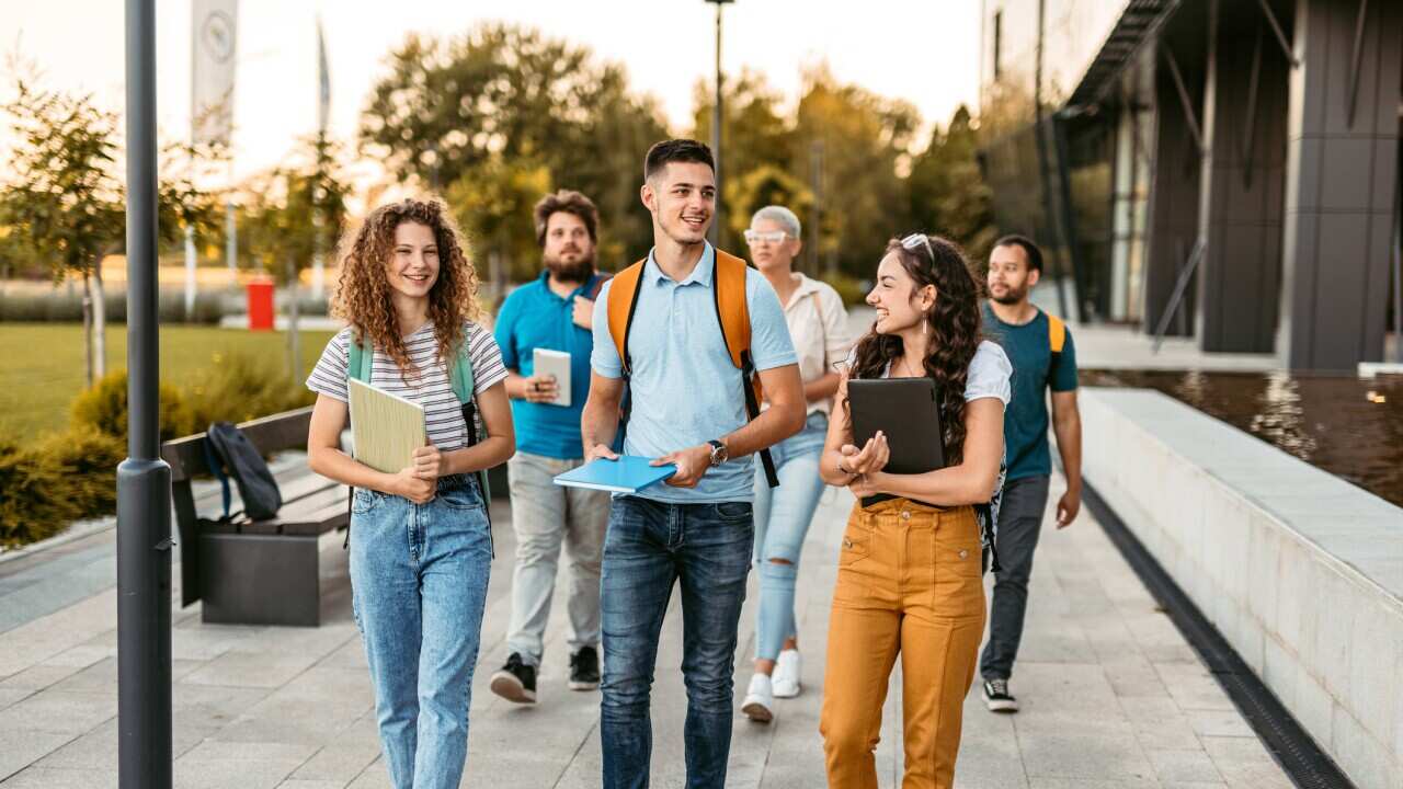Students Walking On The University Campus